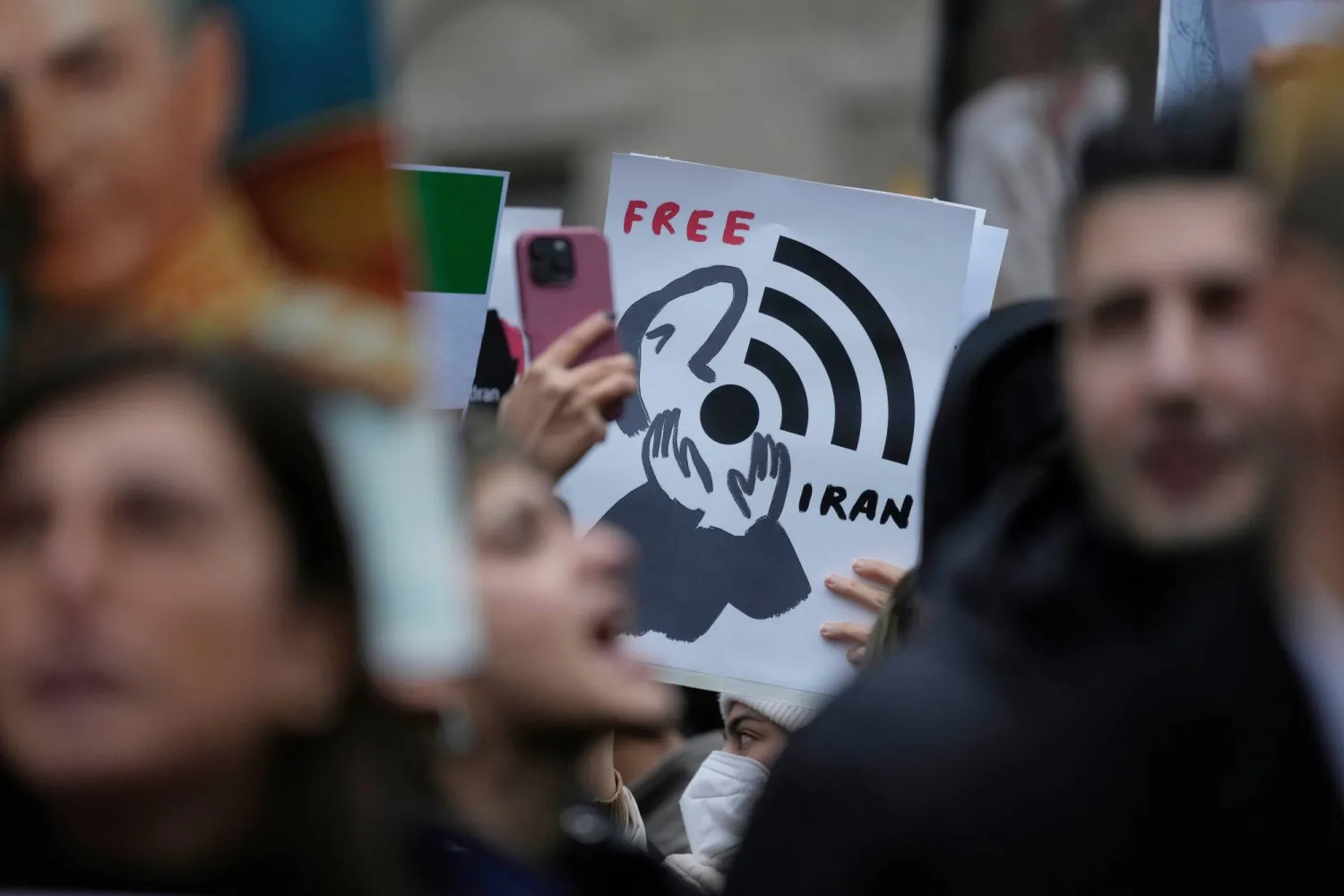 Protesters participate in a demonstration supporting protesters in Iran, in front of the US Consulate, Milan, Italy, Tuesday, Jan. 13, 2026. (AP)