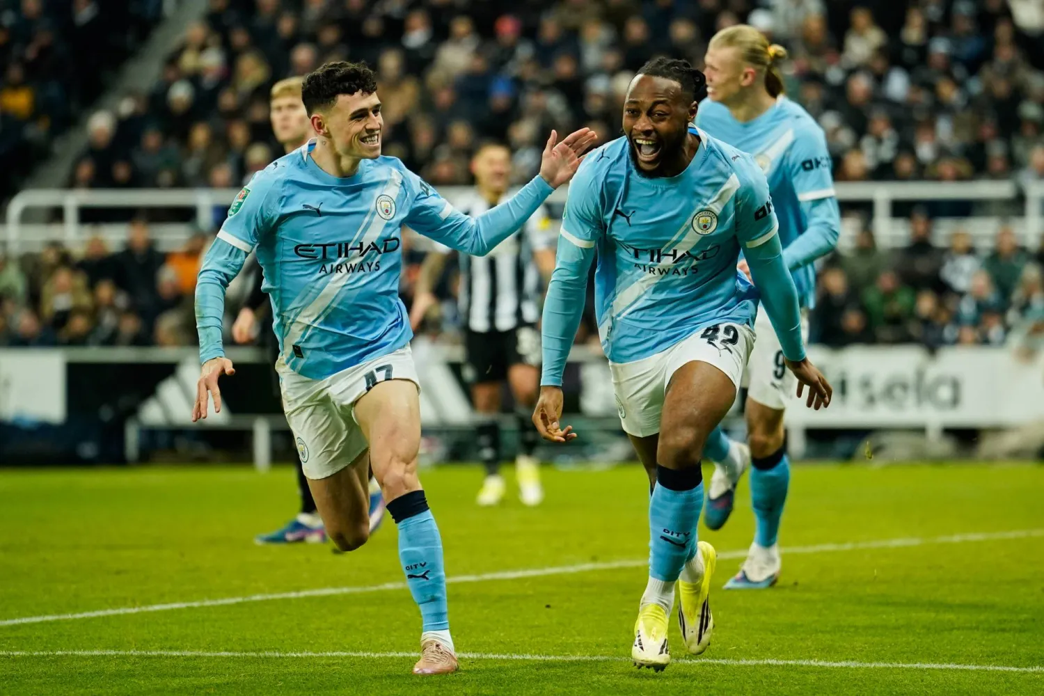 Manchester City's Antoine Semenyo, right, celebrates after scoring his side's opening goal during the English League Cup semi-final first leg match between Newcastle and Manchester City in Newcastle, England, Tuesday, Jan. 13, 2026. (AP)
