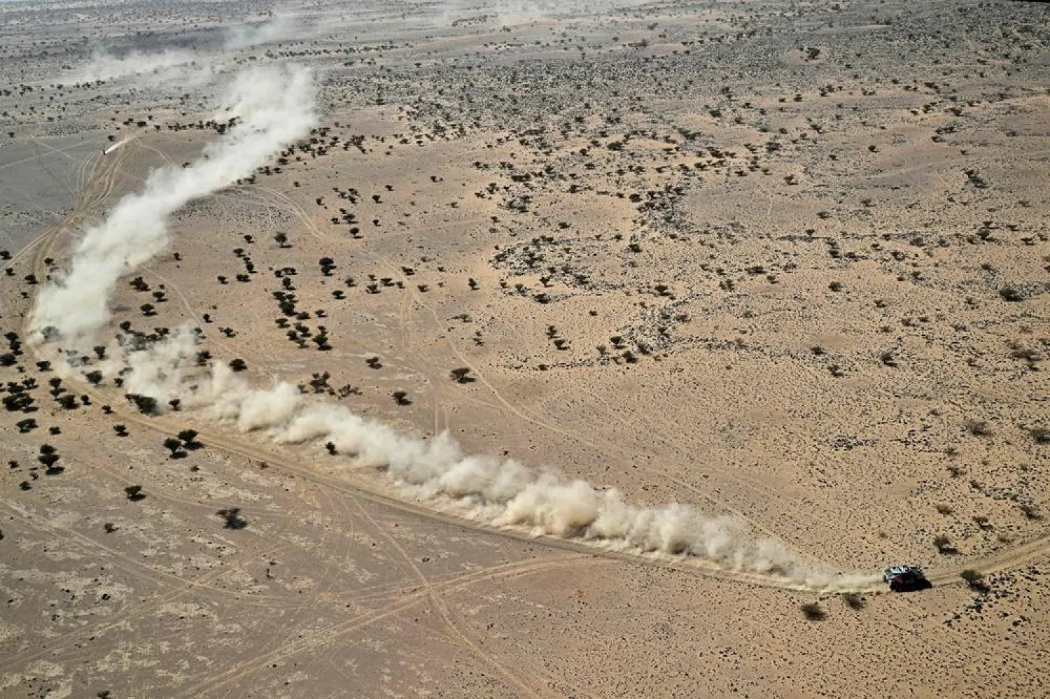 The Dacia Sandriders’ Qatari driver Nasser Al-Attiyah and Belgian co-pilot Fabian Lurquin compete in Stage 11 of the 48th edition of the Dakar Rally 2026, between Bisha and Al Henakiyah, Saudi Arabia, on January 15, 2026. (AFP) 