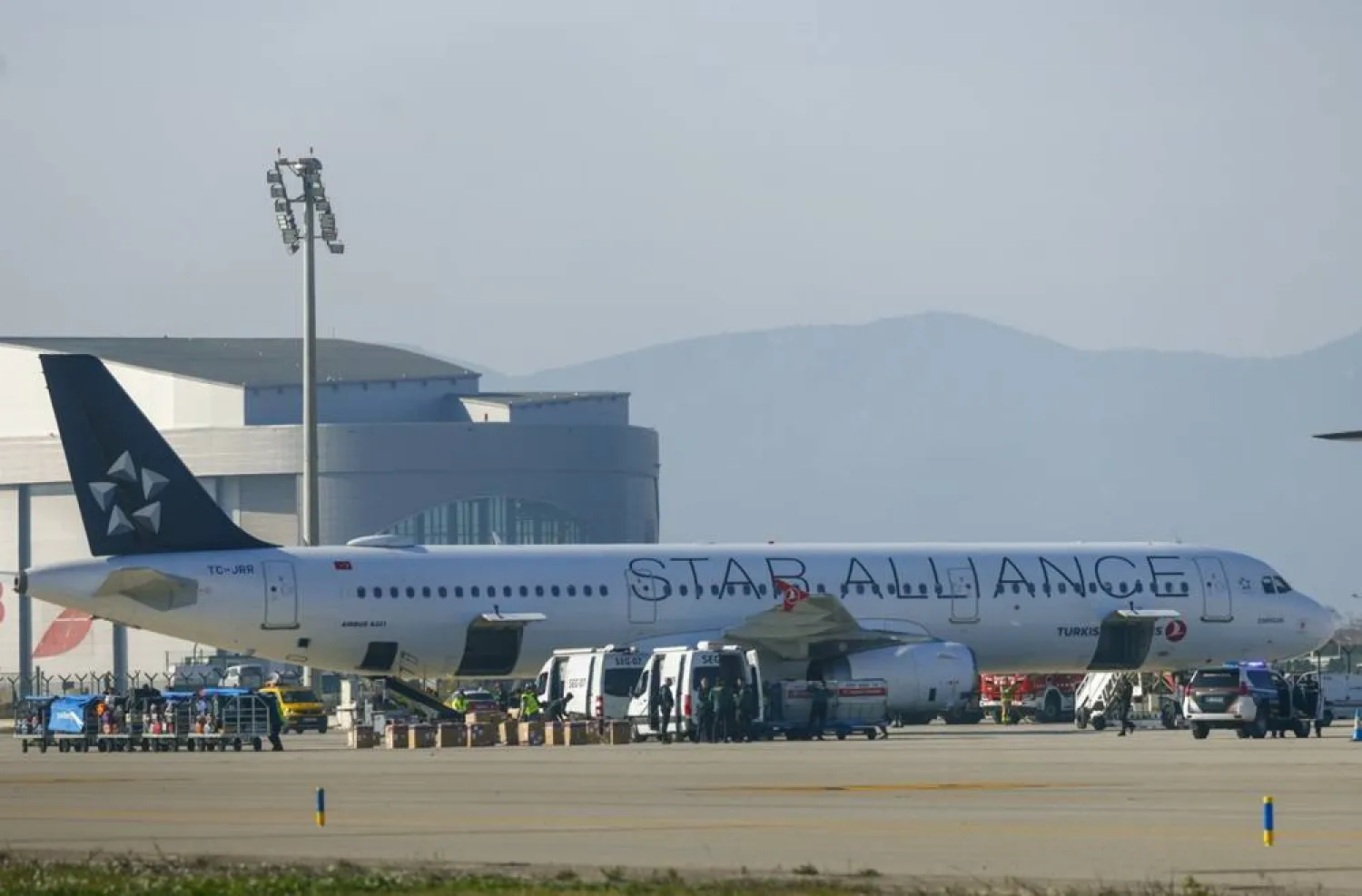 A Turkish Airlines aircraft after landing at El Prat airport, in Barcelona, northeastern Spain, 15 January 2026, after Spanish security forces where alerted due to a bomb threat on board the aircraft. (EPA) 