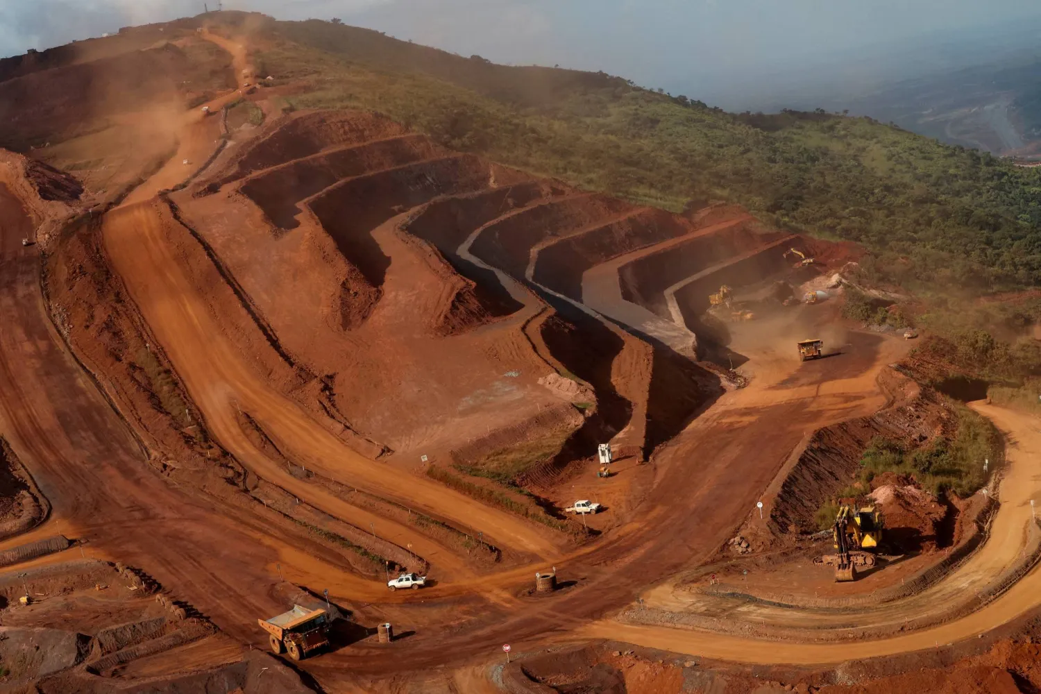  FILE PHOTO: Mining vehicles operate at the blocks three and four of the Simandou mine, one of the largest high-grade iron ore deposits, run by Rio Tinto and partners' joint venture, SimFer, in the Nzerekore Region, Guinea November 4, 2025. REUTERS/Luc Gnago//File Photo 