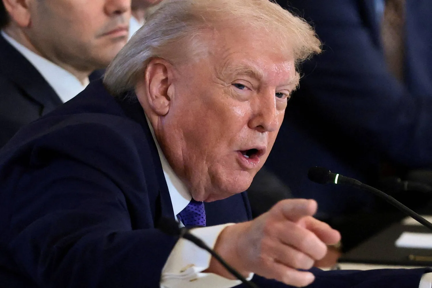 FILE PHOTO: US President Donald Trump points as he attends a meeting with oil industry executives, at the White House in Washington, D.C., US, January 9, 2026. REUTERS/Evelyn Hockstein/File Photo