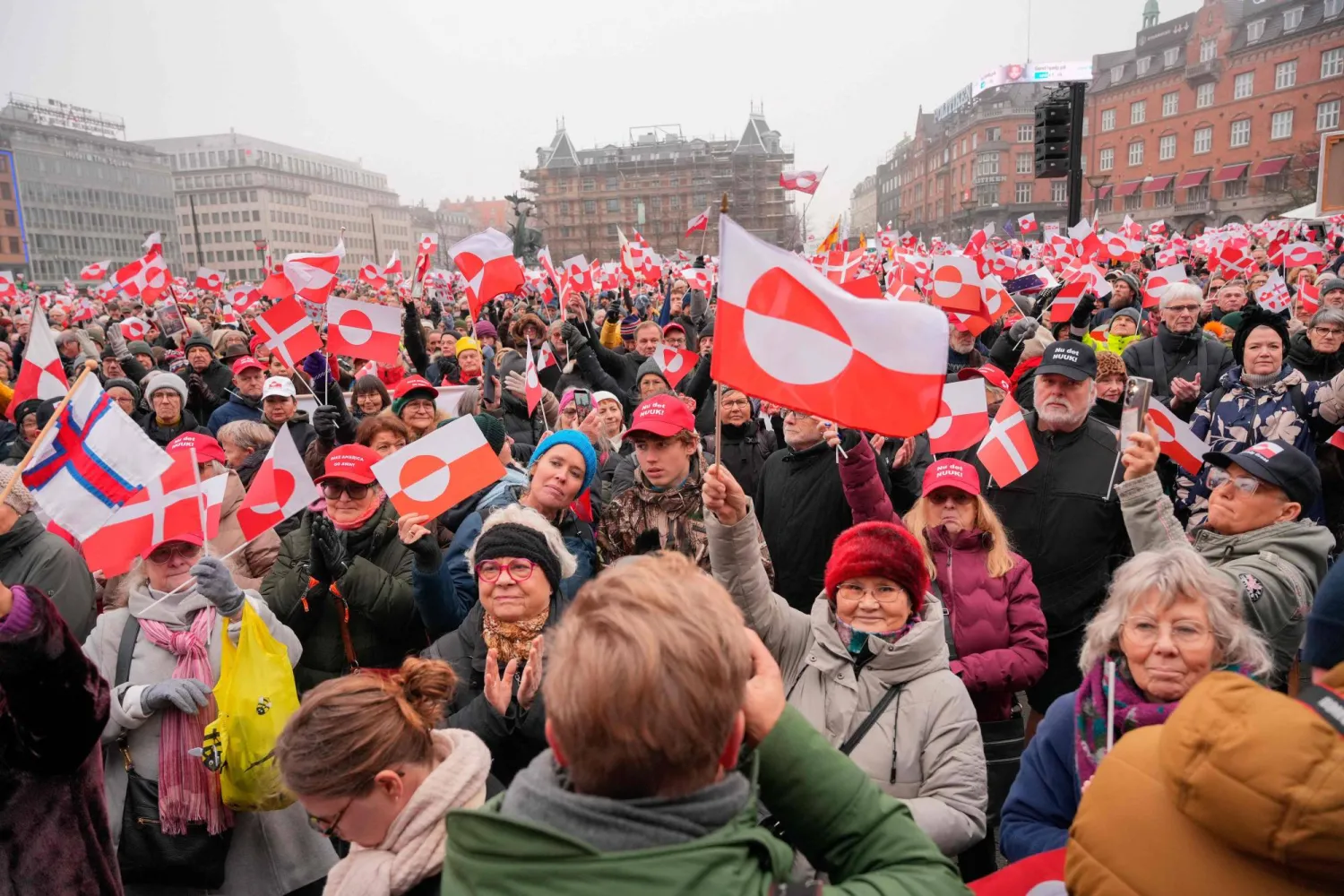 Protesters wave Greenlandic flags as they take part in a rally under the slogans 'hands off Greenland' and 'Greenland for Greenlanders', in front of City Hall in Copenhagen, Denmark on January 17, 2026. (Photo by Emil Helms / Ritzau Scanpix / AFP)