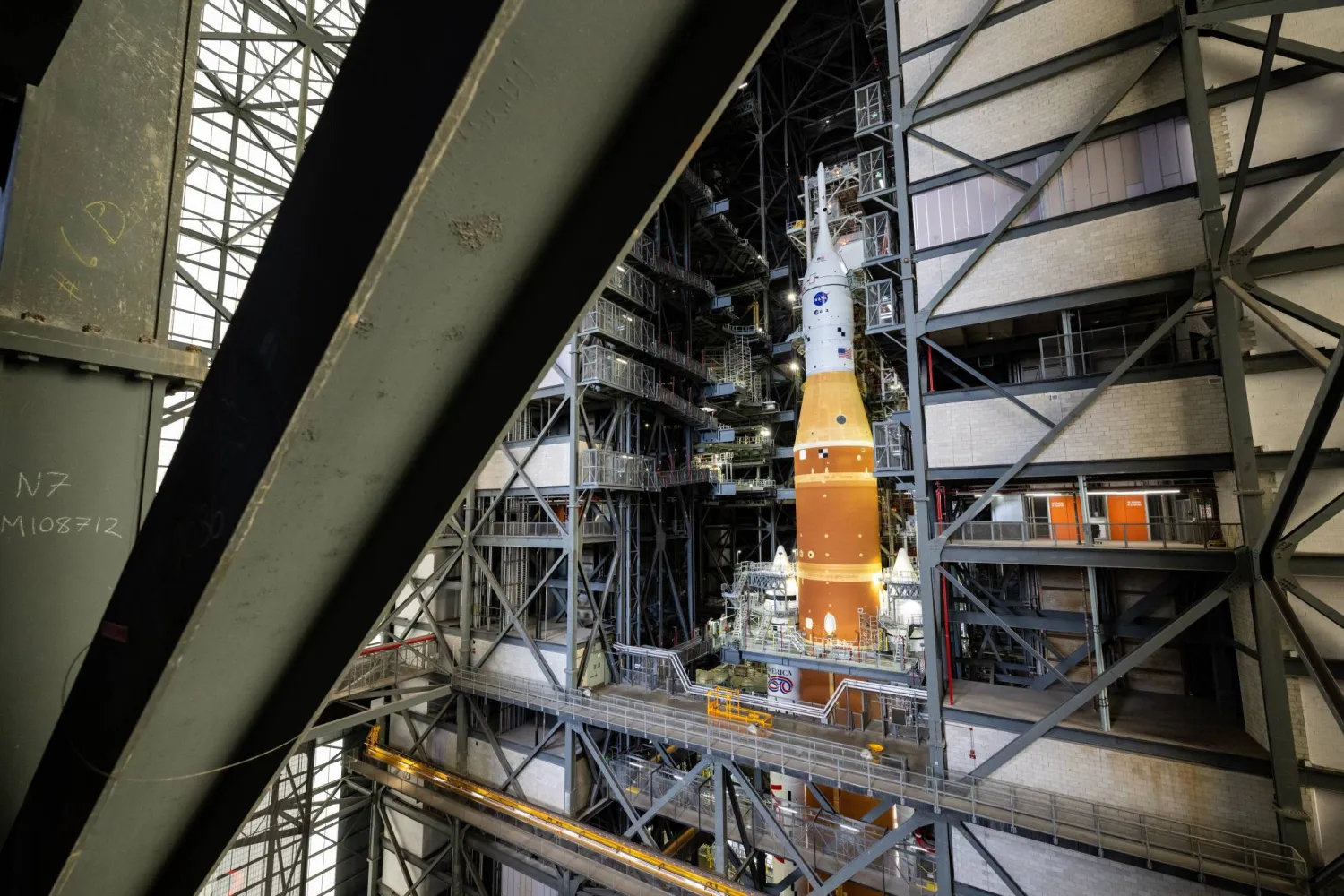 NASA's Artemis II SLS (Space Launch System) rocket and Orion spacecraft, secured to the mobile launcher, is seen inside the Vehicle Assembly building as preparations continue for roll out to Launch Pad 39B, Thursday, Jan. 15, 2026, at NASA's Kennedy Space Center in Florida. (Keegan Barber/NASA via AP)