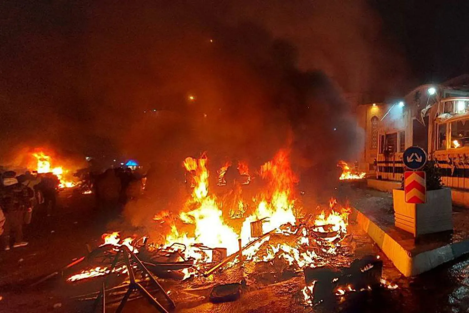 10 January 2026, Iran, Tehran: A police station is set on fire during protests in Tehran in response to worsening economic conditions. ZUMA Press Wire/dpa 