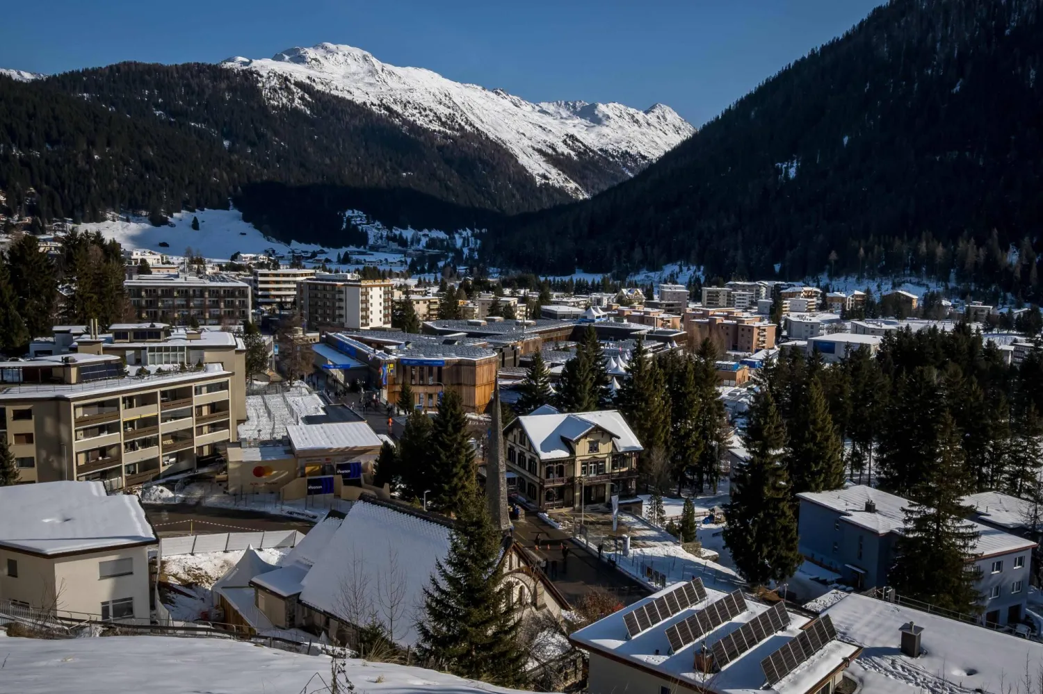 This photograph taken on January 18, 2026 shows a view of the Alpine resort of Davos with the Congress Center that will host the World Economic Forum (WEF) annual meeting. (Photo by Fabrice COFFRINI / AFP)