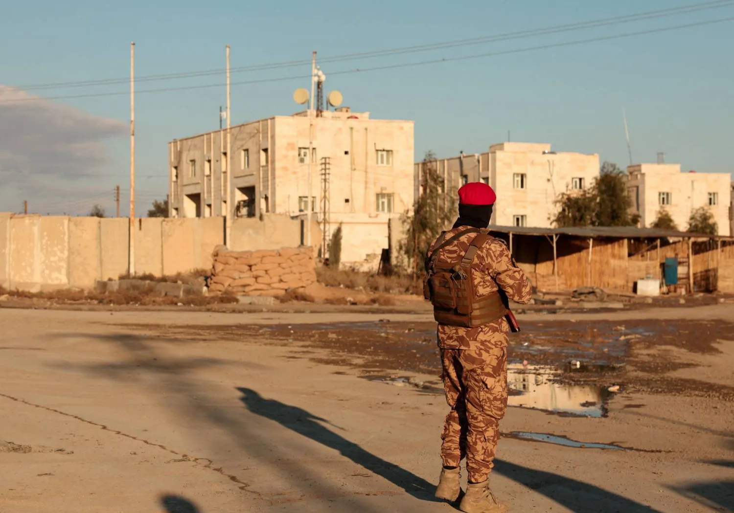  A member of Syrian military police stands guard near Raqqa prison, after the army took control of the city of Raqqa, Syria January 19, 2026. (Reuters)