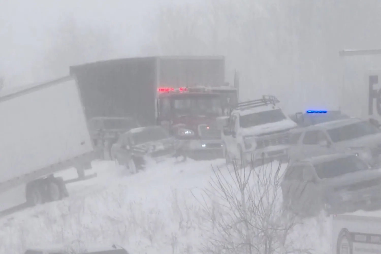 This image taken from video provided by WZZM shows part of a severe multi-car pileup leading Michigan State Police to shut down an interstate south of Grand Rapids Monday, Jan. 19, 2026, in Ottawa County, Mich. (WZZM via AP)