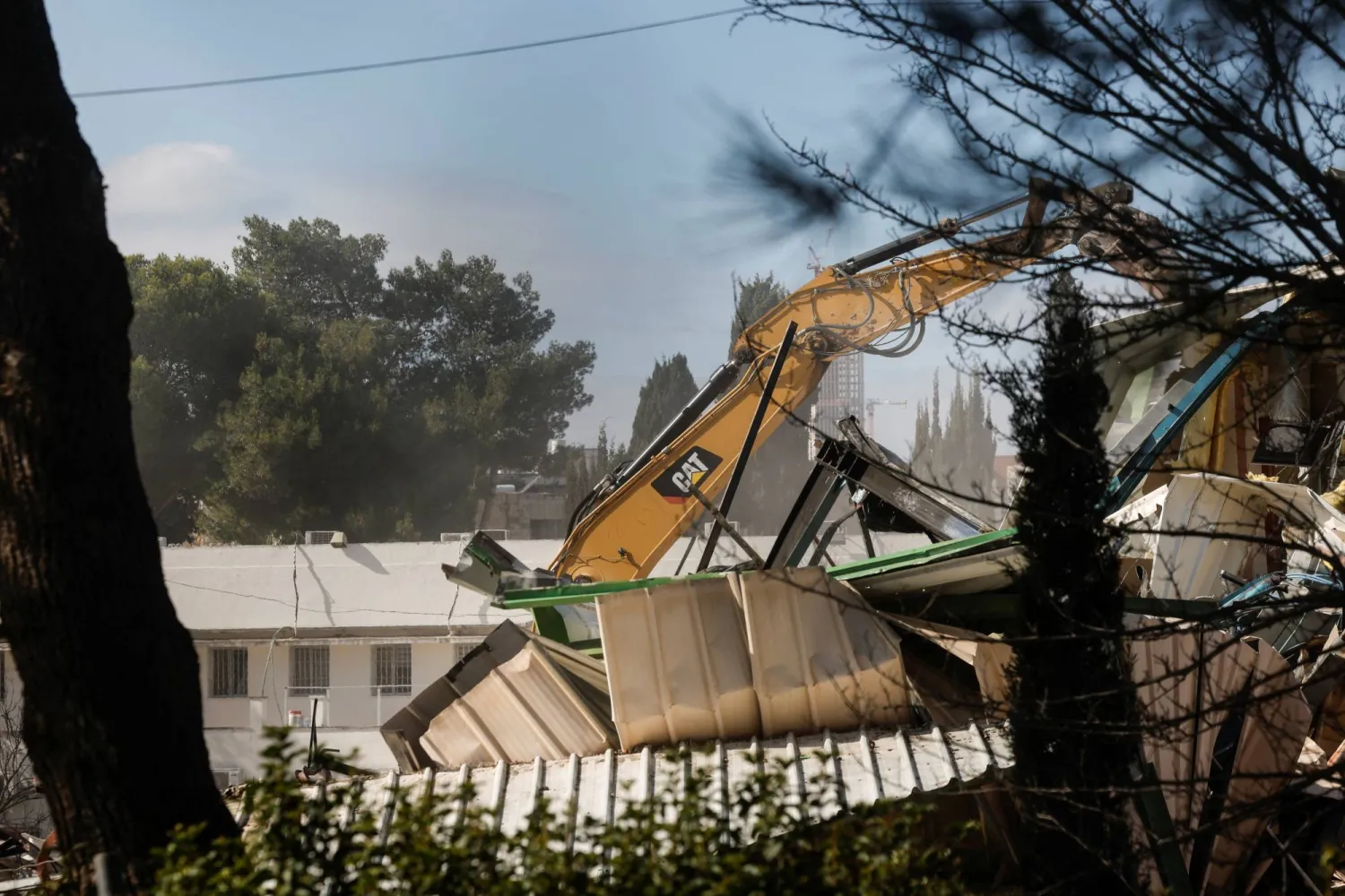 Heavy machinery operates as Israeli forces dismantle the Jerusalem headquarters of UNRWA, in East Jerusalem, January 20, 2026. (Reuters)