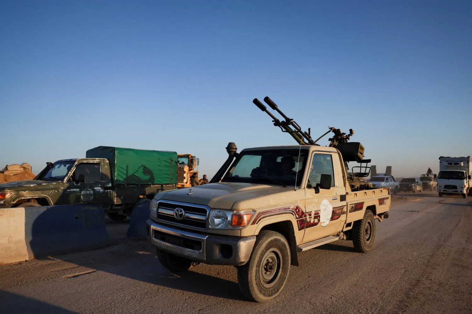 Members of the Syrian army ride a vehicle en route to al-Hassakeh, following the withdrawal of the Syrian Democratic Forces, Syria, January 20, 2026. (Reuters)