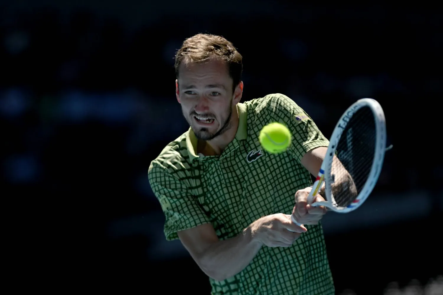 21 January 2026, Australia, Melbourne: Daniil Medvedev of Russia in action during the Men's 2nd round match against Quentin Halys of France on day 4 of the 2026 Australian Open tennis tournament at Melbourne Park in Melbourne. (Lukas Coch/AAP/dpa)
