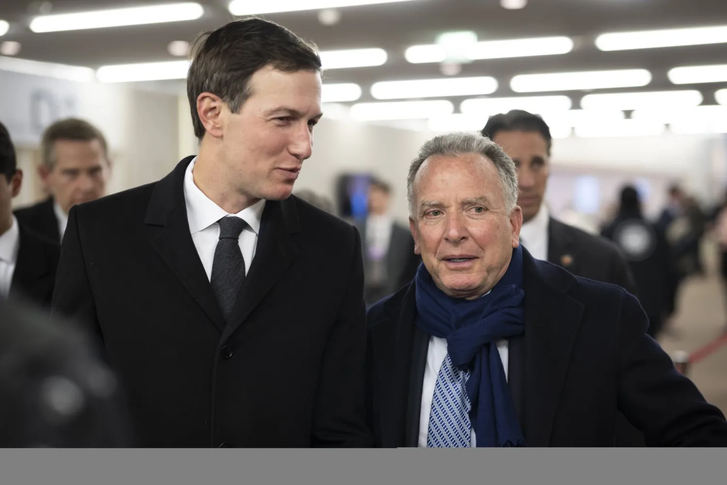 Jared Kushner (L), American businessman and Steve Witkoff (R), United States Special Envoy to the Middle East and special envoy for peace missions walk in the corridors during the 56th annual meeting of the World Economic Forum (WEF) in Davos, Switzerland, 20 January 2026. (EPA)