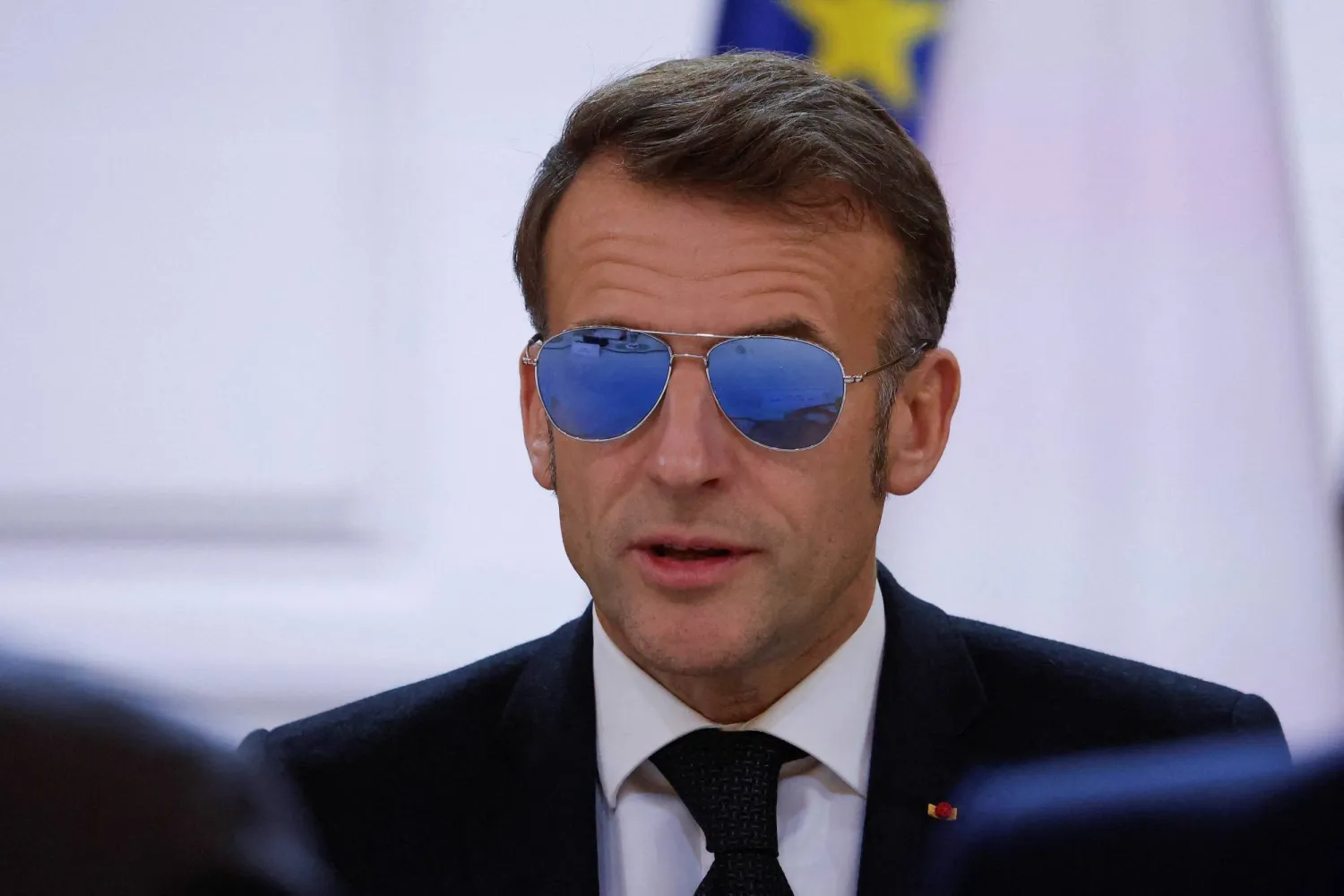  French President Emmanuel Macron, wearing sunglasses, speaks during a meeting on the institutional future of New Caledonia at the Elysee Palace in Paris, France, January 16, 2026. (Reuters)