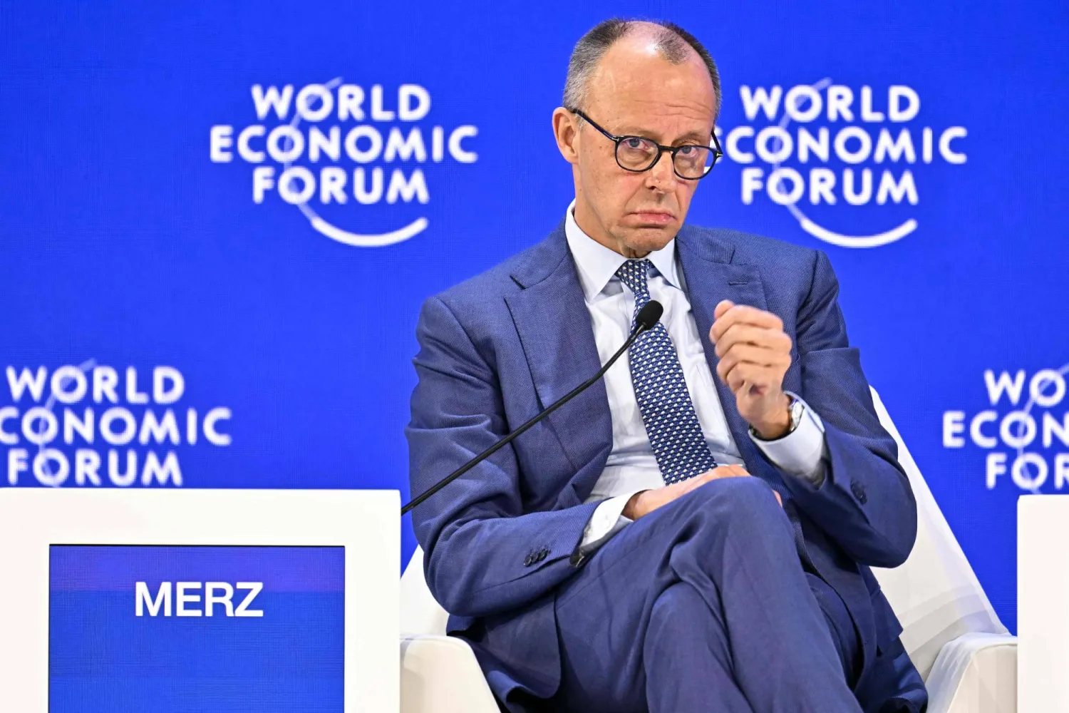 Germany's Chancellor Friedrich Merz gestures as he speaks during the World Economic Forum (WEF) annual meeting in Davos on January 22, 2026. (Photo by Fabrice COFFRINI / AFP)