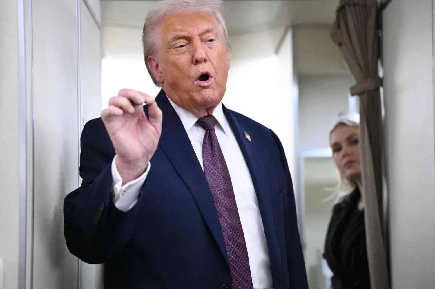 US President Donald Trump speaks to reporters while in flight on Air Force One, traveling from Shannon, Ireland en route to the Joint Base Andrews in Maryland on January 22, 2026. (AFP)