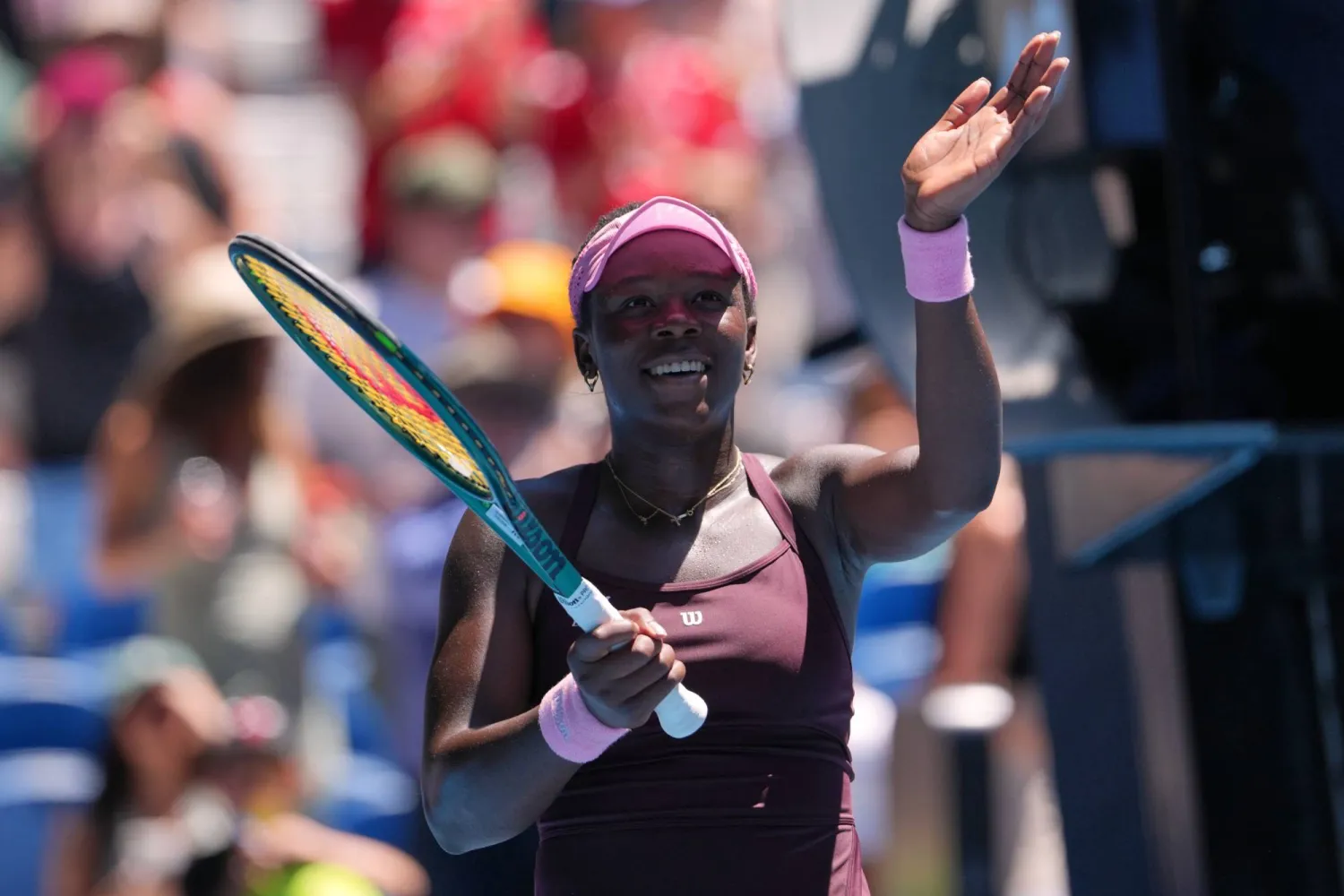 Victoria Mboko of Canada waves after defeating Clara Tauson of Denmark in their third round match at the Australian Open tennis championship in Melbourne, Australia, Friday, Jan. 23, 2026. (AP)