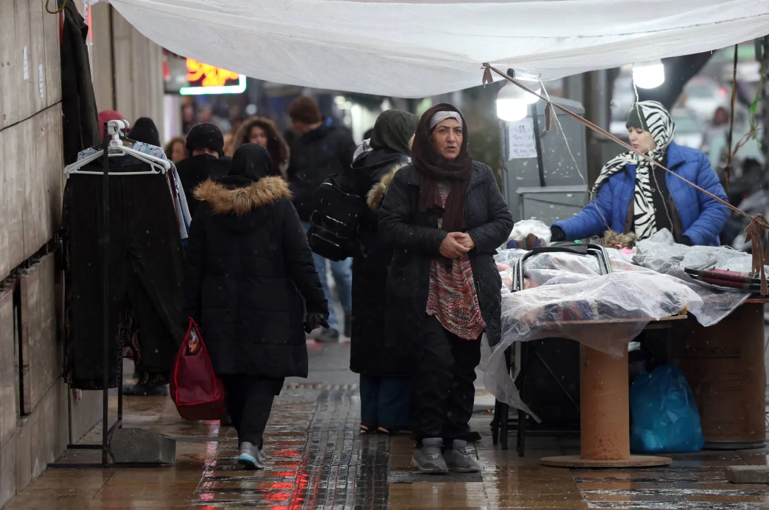 Iranians shop in a street market in Tehran, Iran, 20 January 2026. (EPA)