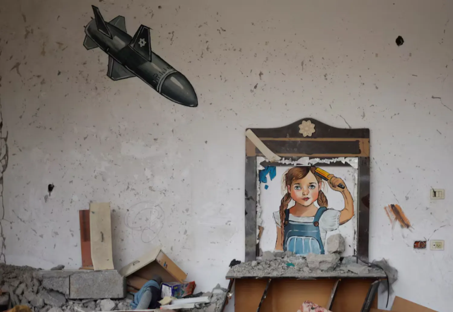 A painting drawn by artists is seen at a house destroyed by Israel, in recent Israeli-Gaza fighting, in Deir Al-Balah, central Gaza Strip June 13, 2023. REUTERS/Mohammed Salem 