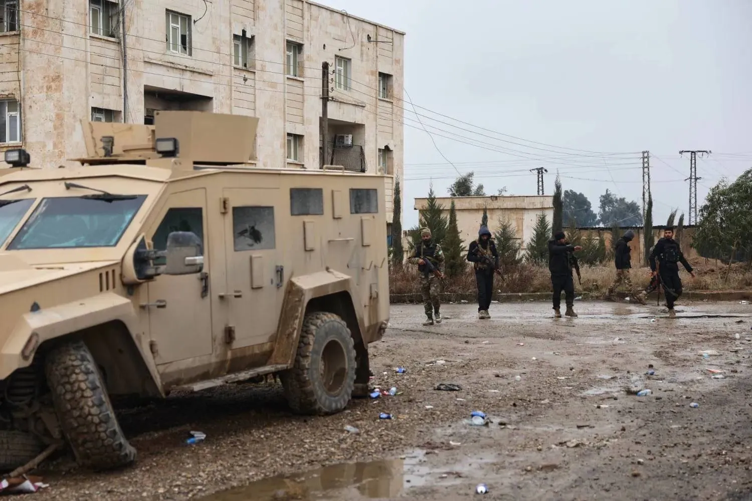 Syrian government forces inspect al-Aqtan prison in Raqqa after the SDF withdrew from the facility on Friday, Jan. 23 (AP). 