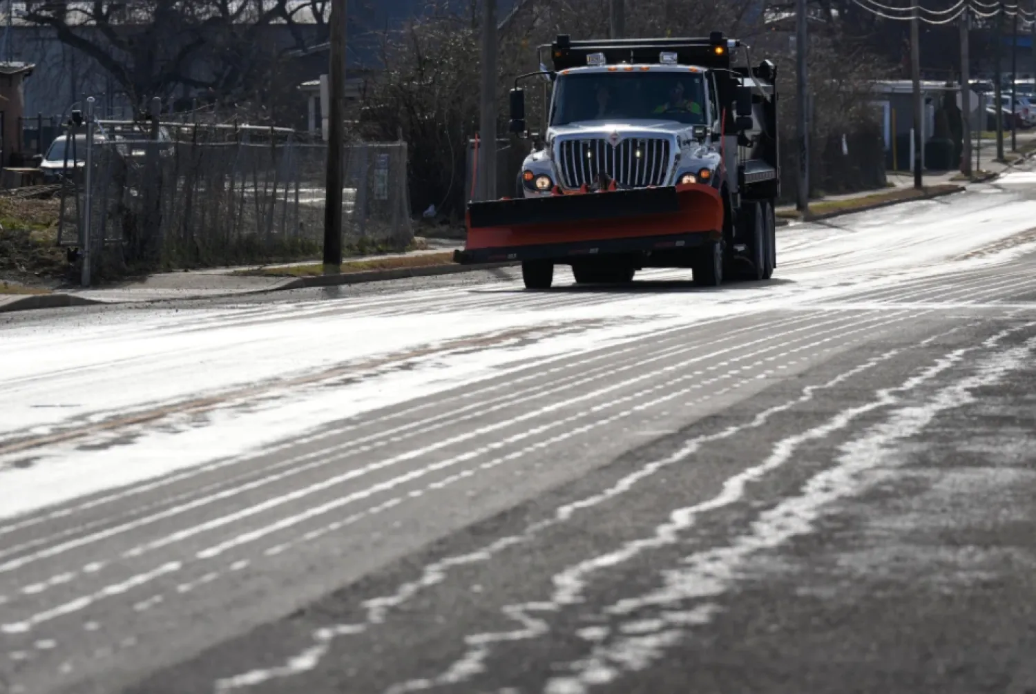 A Nashville Department of Transportation truck applies salt brine to a roadway Thursday, Jan. 22, 2026, in Nashville, Tenn. ahead of a winter storm expected to hit the state over the weekend. (AP Photo/George Walker IV)