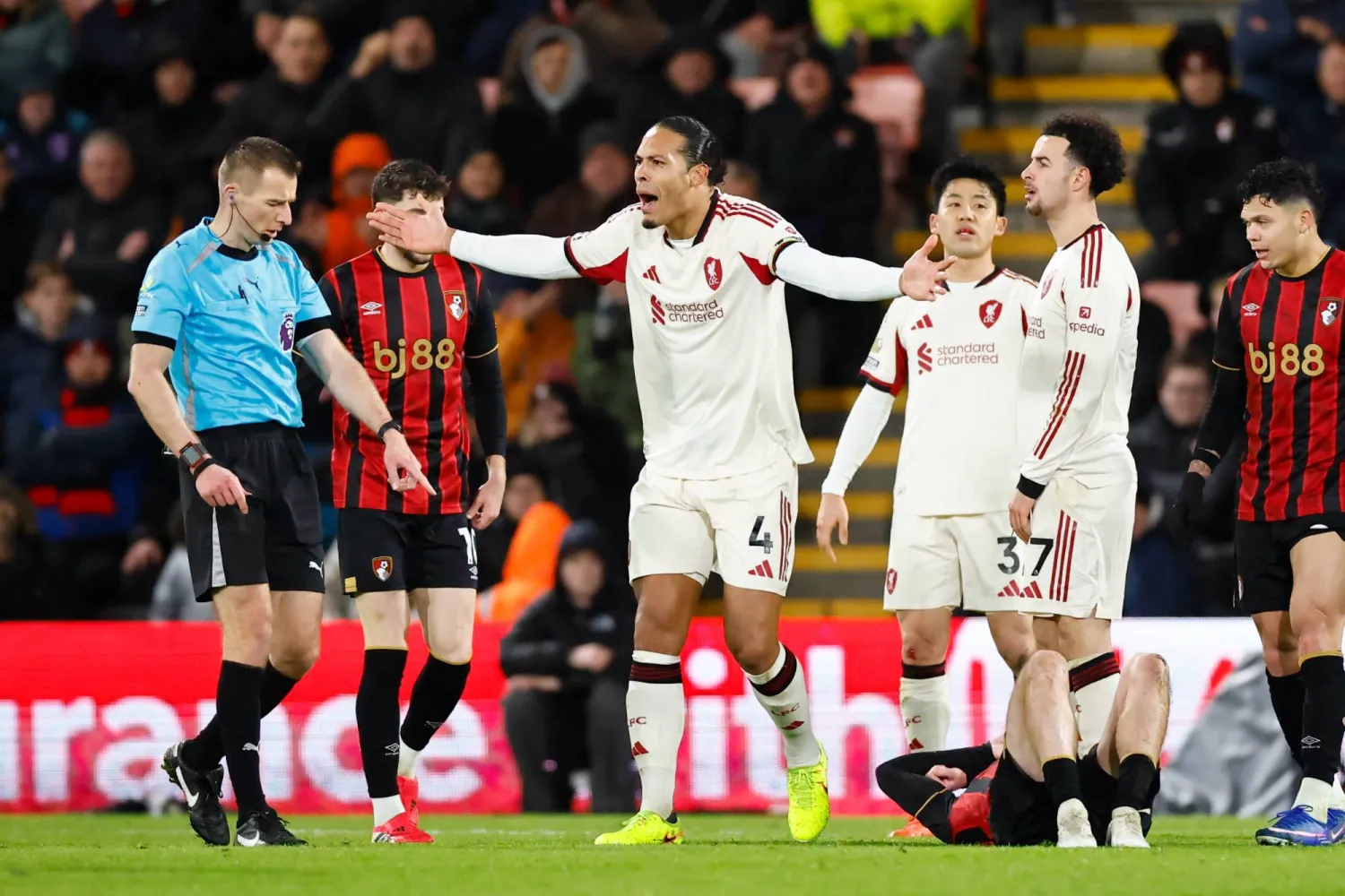 Virgil van Dijk of Liverpool (C) argues with the referee Michael Salisbury (L) during the English Premier League match between AFC Bournemouth and Liverpool FC, in Bournemouth, Britain, 24 January 2026. (EPA)