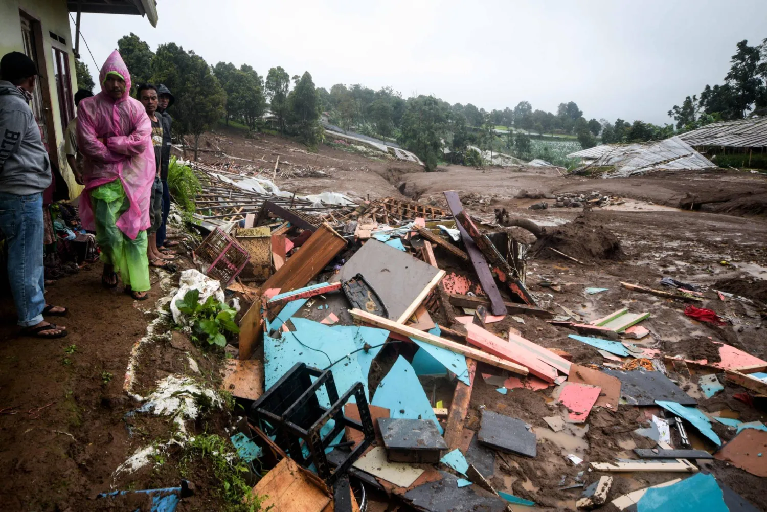 Debris from destroyed houses remains after a landslide struck in Pasirlangu village, Bandung, West Java, on January 24, 2026. (AFP)