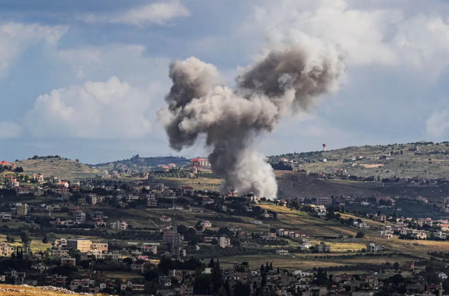 Smoke rises above Lebanon, following an Israeli strike, amid ongoing cross-border hostilities between Hezbollah and Israeli forces, as seen from Israel's border with Lebanon in northern Israel, May 5, 2024. REUTERS/Ayal Margolin /File Photo 