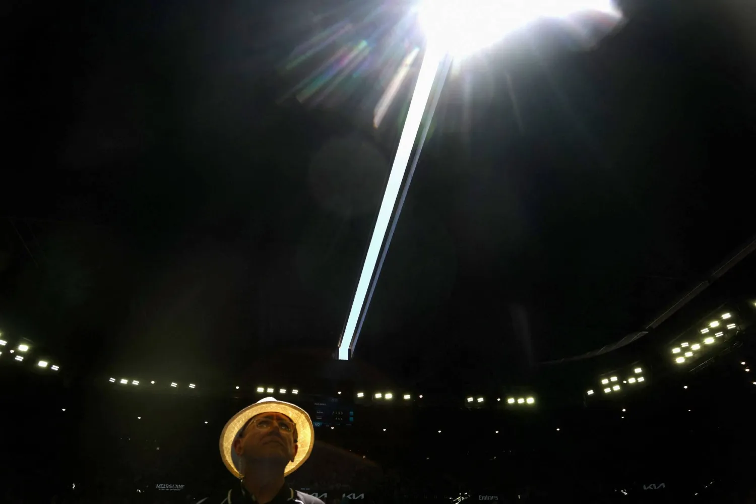 A security officer looks on as the roof of Rod Laver Arena is closed due to extreme heat during the men's singles match between Italy's Jannik Sinner and USA's Eliot Spizzirri on day seven of the Australian Open tennis tournament in Melbourne on January 24, 2026. (AFP)