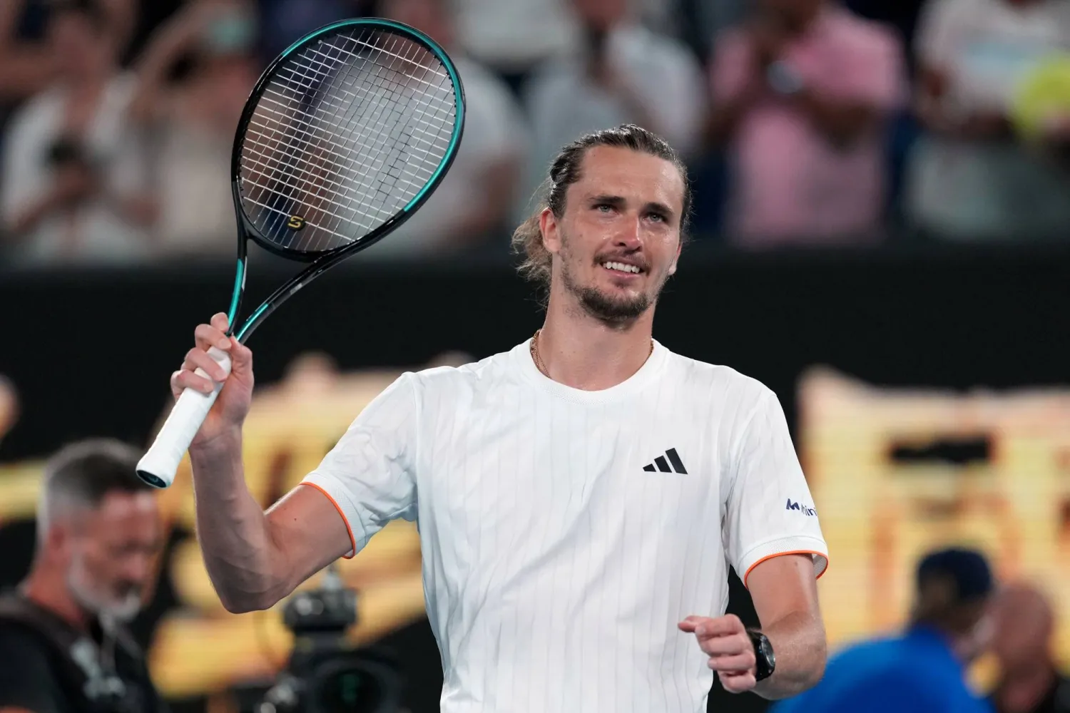 Alexander Zverev of Germany waves after defeating Learner Tien of the US in their quarterfinal match at the Australian Open tennis championship in Melbourne, Australia, Tuesday, Jan. 27, 2026. (AP)