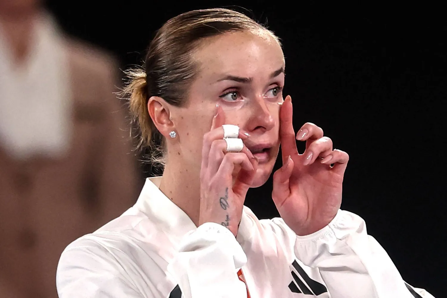 Ukraine's Elina Svitolina wipes her tears as she speaks with media after defeating USA's Coco Gauff during their women's singles quarter-final match on day ten of the Australian Open tennis tournament in Melbourne on January 27, 2026. (AFP)