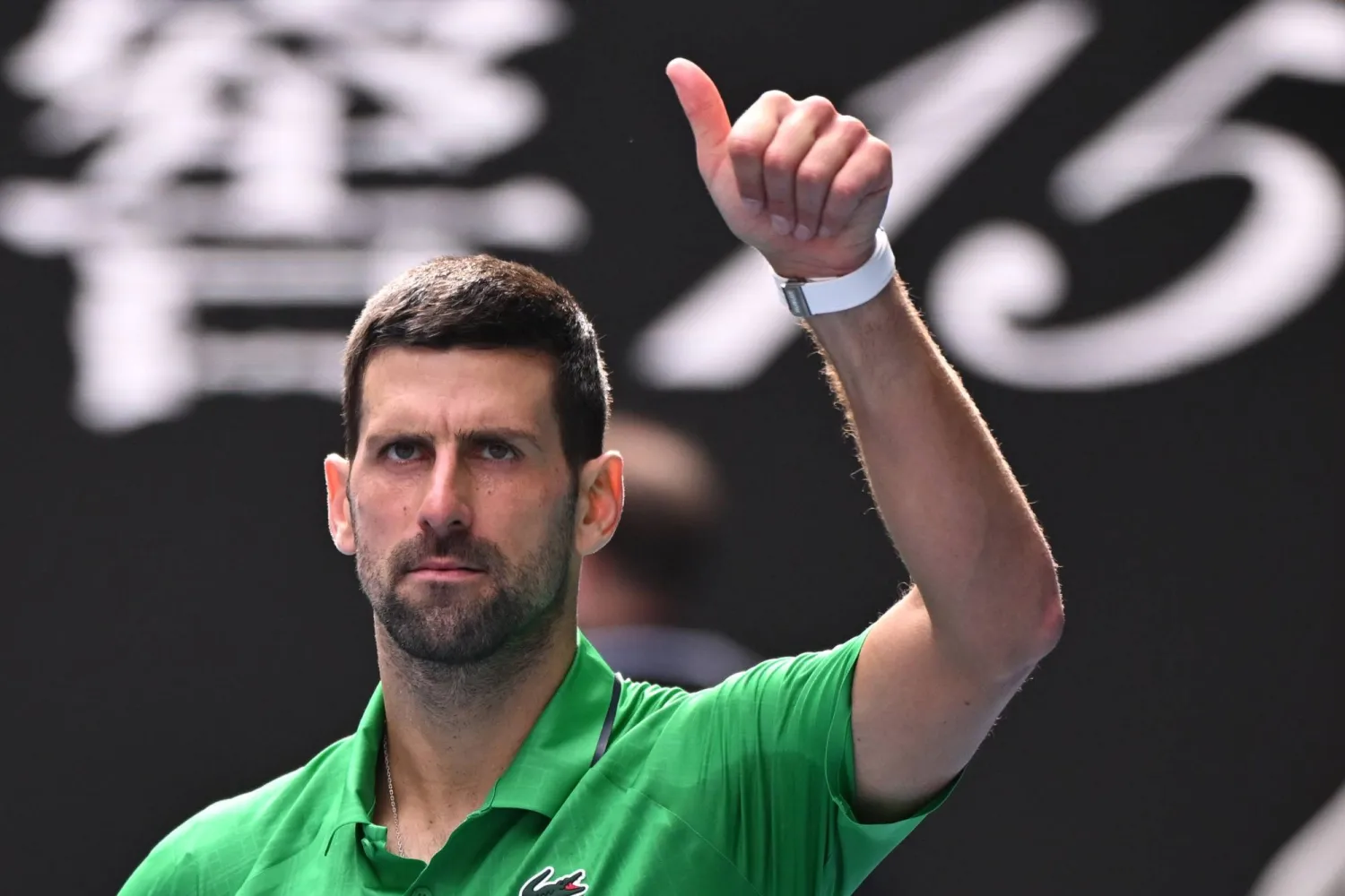 Novak Djokovic of Serbia gestures after Lorenzo Musetti of Italy retired due to injury during their men’s quarterfinals match on day 11 of the 2026 Australian Open tennis tournament at Melbourne Park in Melbourne, Australia, 28 January 2026. (EPA) 