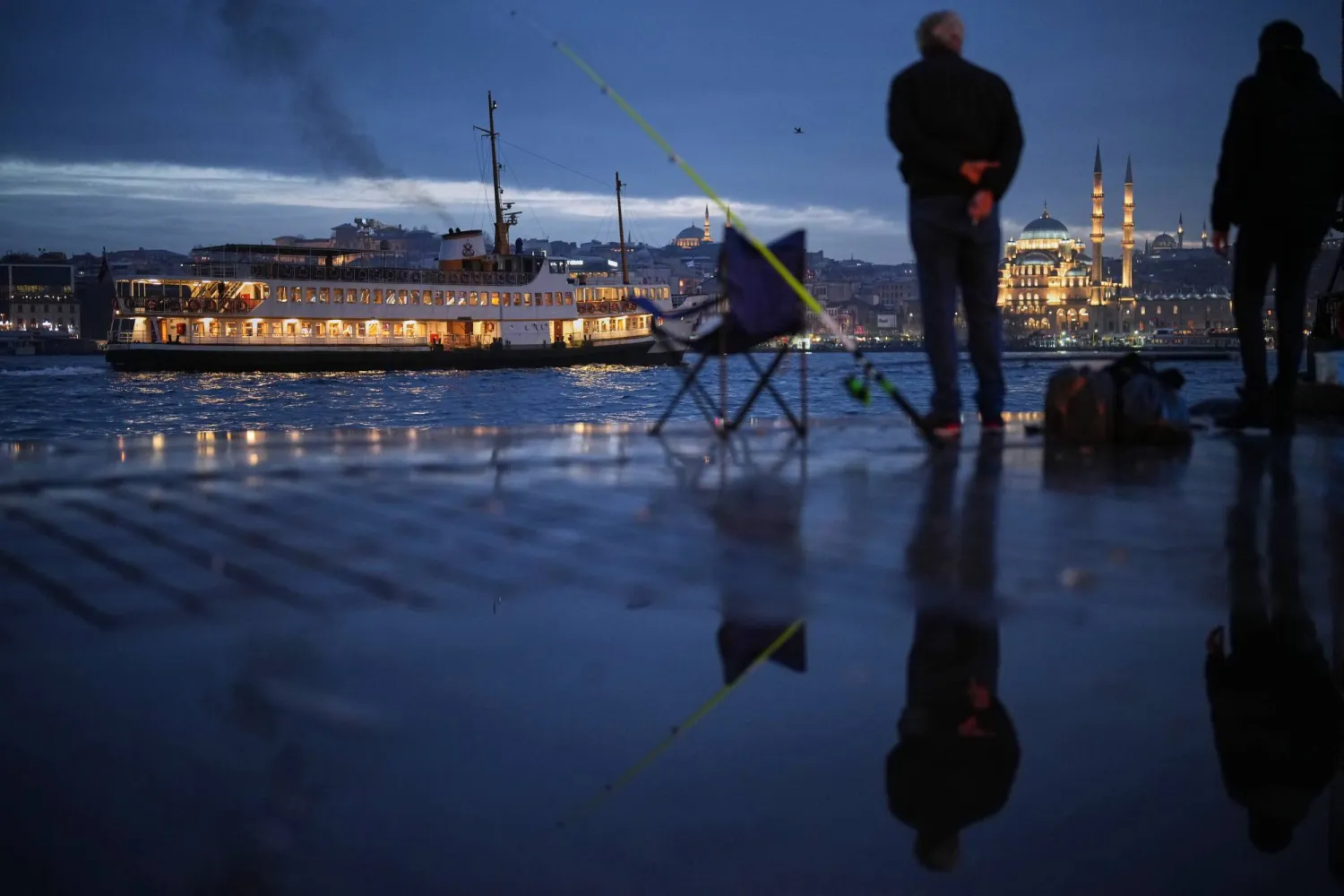 A ferry sails along the Bosphorus next to the Golden Horn, in Istanbul, Türkiye, Friday, Jan. 23, 2026. (AP)