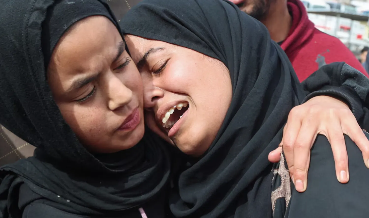 Mourners react during the funeral of Palestinians who, according to medics, were killed by Israeli gunfire on Thursday, at Nasser Hospital in Khan Younis, in the southern Gaza Strip. REUTERS/Ramadan Abed 