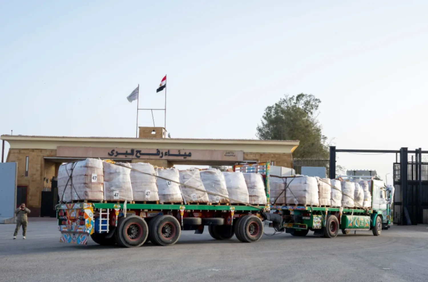 A truck enters the Egyptian gate of the Rafah crossing, heading for inspection by Israeli authorities before entering the Gaza Strip, Tuesday, Jan. 27, 2026. (AP Photo/Mohamed Arafat)

