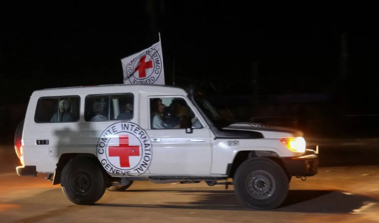 A Red Cross vehicle, as part of a convoy believed to be carrying hostages abducted by Hamas armed men during the Oct. 7 attack on Israel, arrives at the Rafah border, amid a hostages swap deal between Hamas and Israel, in the southern Gaza Strip, Nov. 24, 2023. (Reuters)
