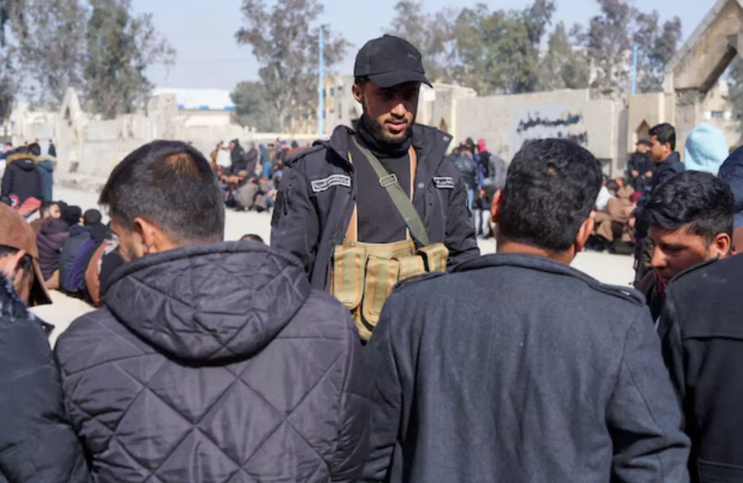 Members of the Kurdish-led Syrian Democratic Forces (SDF) queue to settle their status with Syrian government in Raqqa, Syria January 27, 2026. REUTERS/Karam al-Masri 