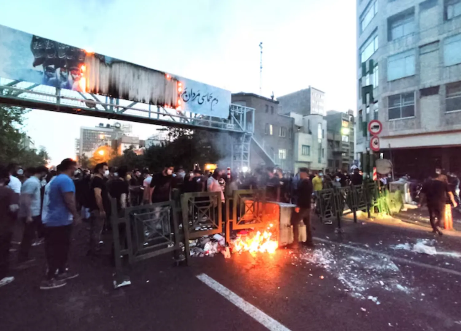 People light a fire during a protest over the death of Mahsa Amini, a woman who died after being arrested by the Islamic republic's "morality police", in Tehran, Iran September 21, 2022. WANA (West Asia News Agency) via REUTERS 