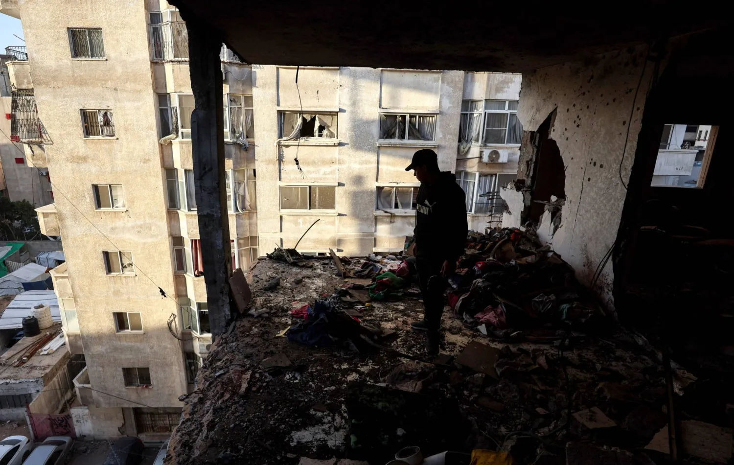 A Palestinian inspects the site of an Israeli strike on Saturday, in Gaza City, January 31, 2026. REUTERS/Dawoud Abu Alkas