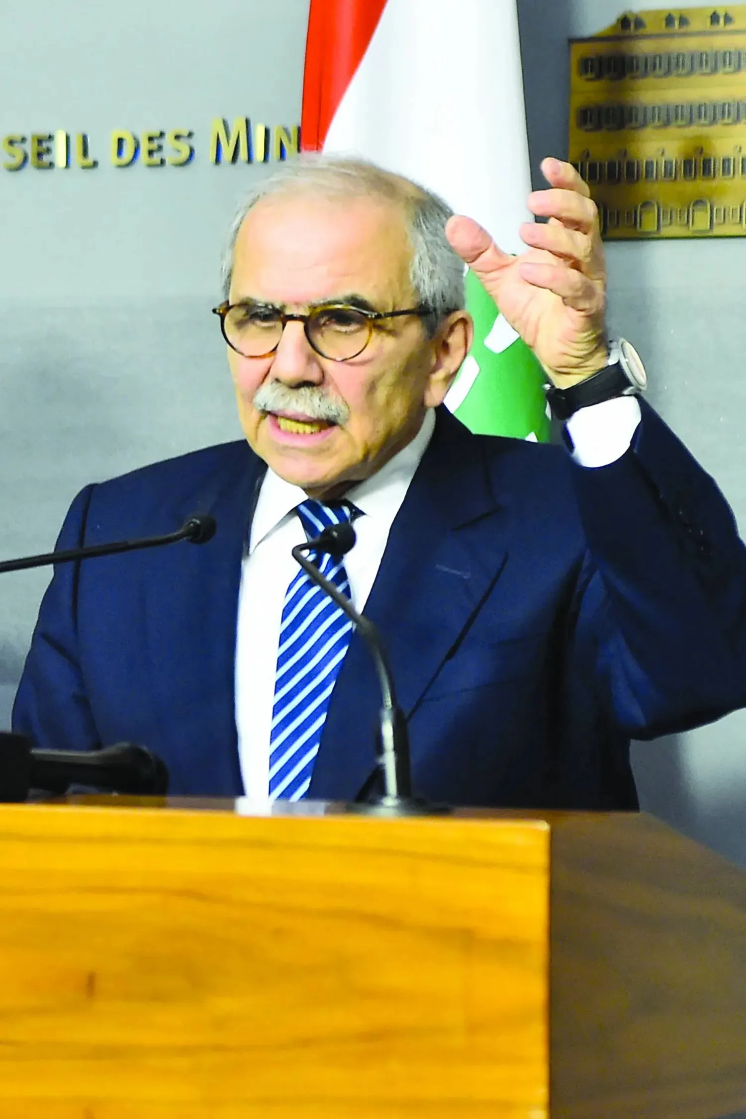 A photograph released by the Lebanese Government Press Office on December 26, 2025, show Lebanon's Prime Minister Nawaf Salam speaking during a press conference following a cabinet session in Beirut on December 26, 2025. (Photo by Handout / Lebanese Government Press Office / AFP)   