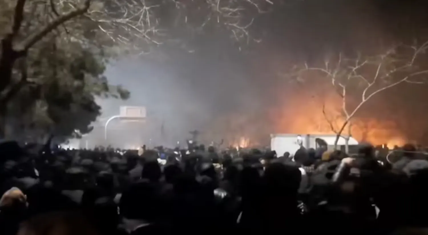 Smoke rises as protesters gather amid evolving anti-government unrest at Vakilabad highway in Mashhad, Razavi Khorasan province, Iran, released on January 10, 2026, in this screen grab obtained from a social media video. SOCIAL MEDIA/via REUTERS 