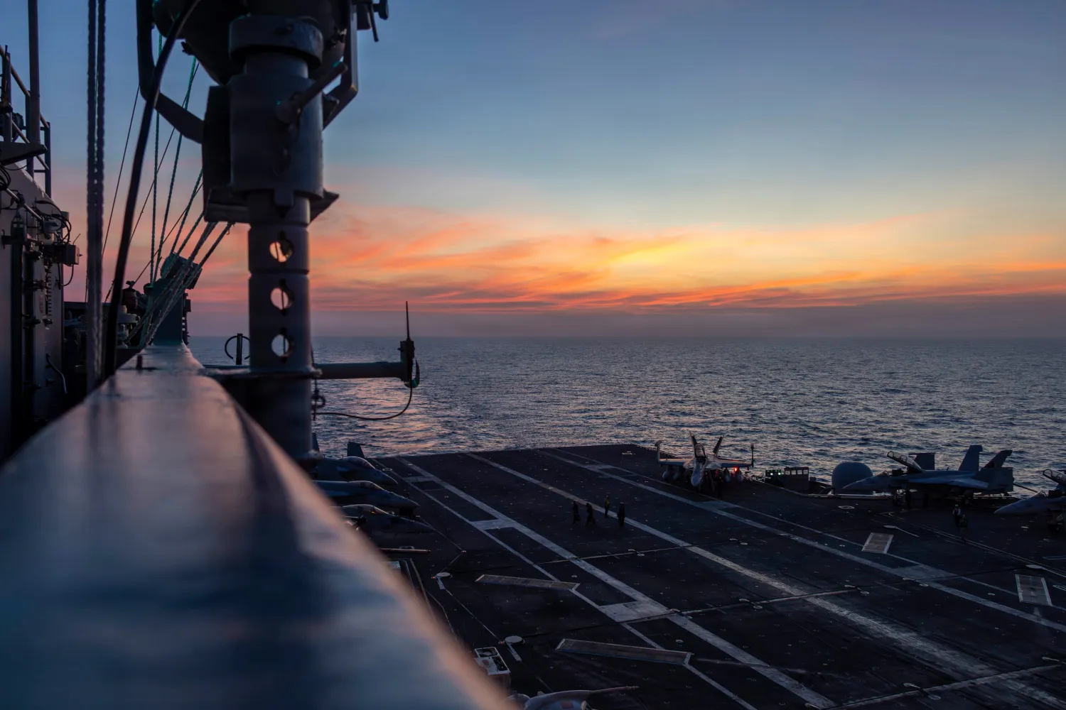 This photo provided by the US Navy shows the sun setting over the Nimitz-class aircraft carrier USS Abraham Lincoln in the Indian Ocean on Jan. 22, 2026. (Mass Communication Specialist Seaman Angel Campbell/US Navy via AP) 