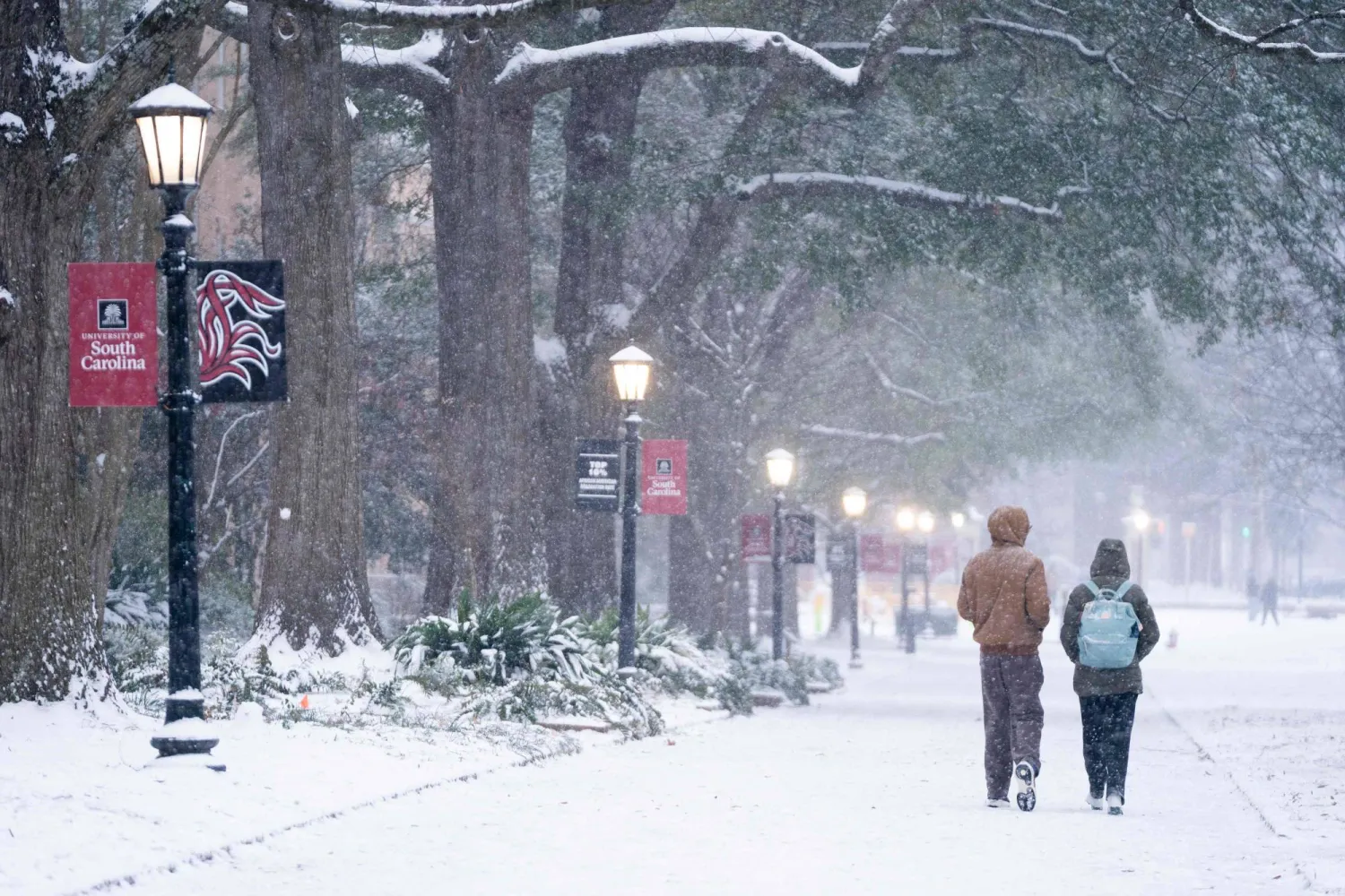 Students walk across the historic Horseshoe as snow falls at the University of South Carolina on January 31, 2026 in Columbia, South Carolina. (Getty Images/AFP)