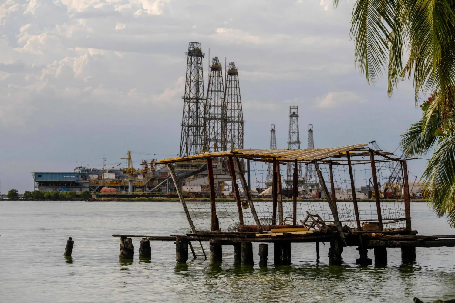 Oil rigs are pictured in Cabimas, south of Lake Maracaibo, Zulia State, Venezuela, on January 31, 2026. (Photo by Maryorin Mendez / AFP)