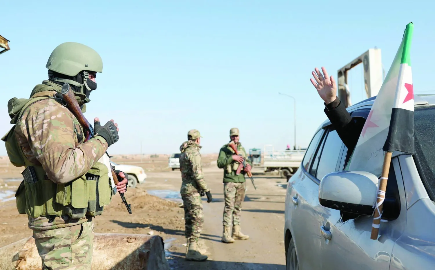A resident greets Syrian government forces south of Hasakah, in northeastern Syria, on Jan. 20, 2026. (Credit: Omar Haj Kadour/AFP) 