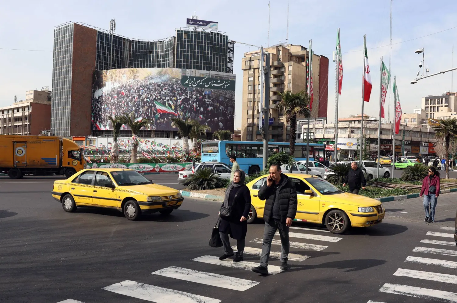  Iranians walk in a street in Tehran, Iran, 02 February 2026. (EPA)