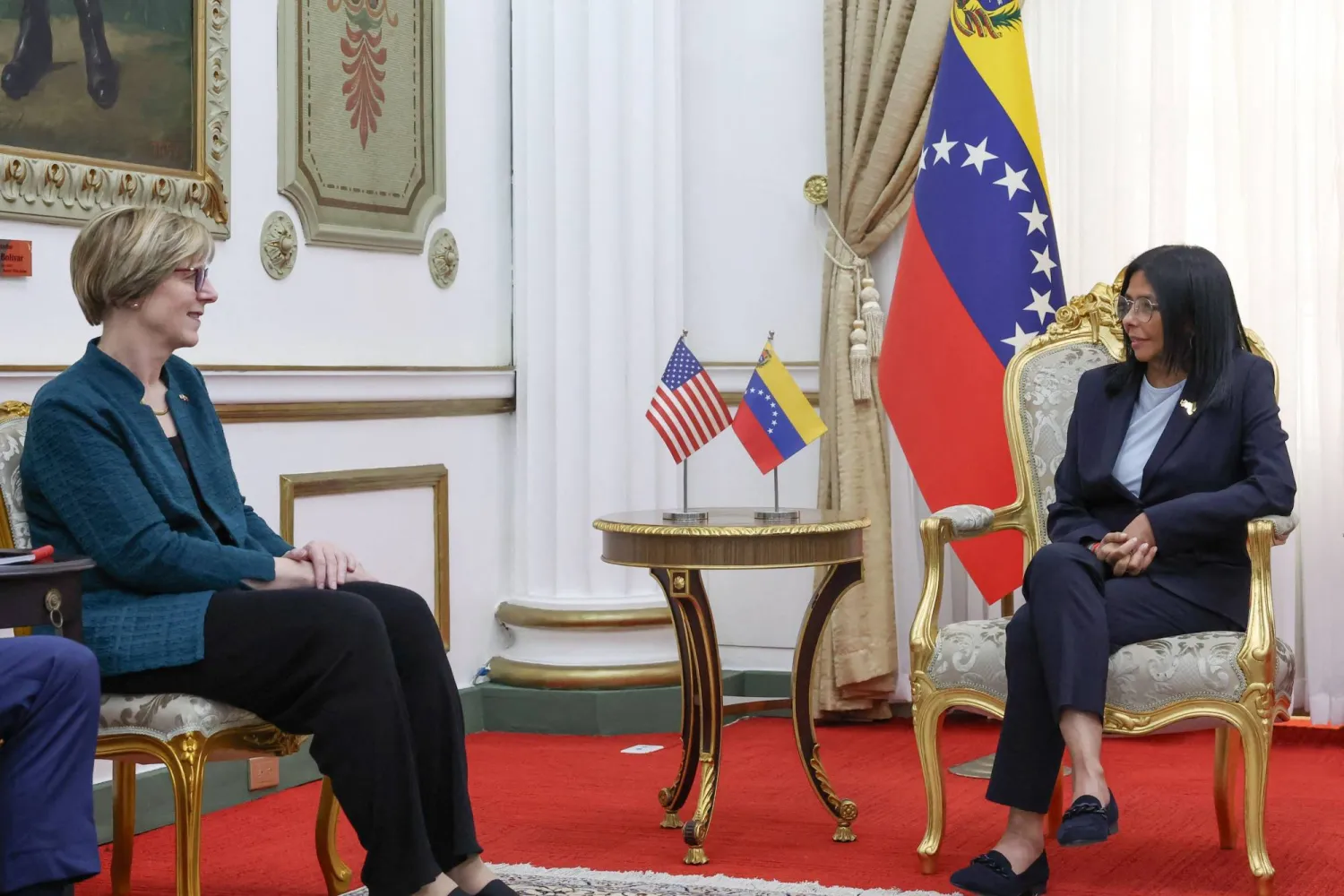 This handout picture released by the Venezuelan Presidency shows Venezuela's interim President Delcy Rodriguez (R) talking with the new head of the United States diplomatic mission for Venezuela Laura Dogu during meeting at the Miraflores Presidential Palace in Caracas on February 2, 2026. (Daniela Millan / Venezuelan Presidency / AFP)