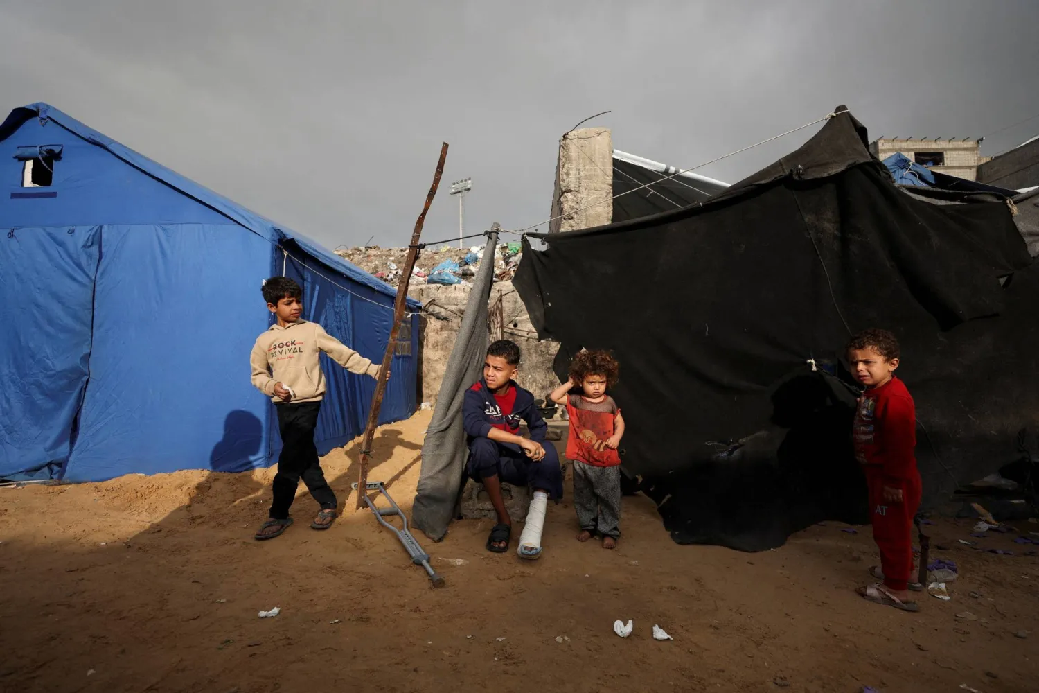  Displaced Palestinian children gather at a tent camp in Gaza City, February 3, 2026. (Reuters)