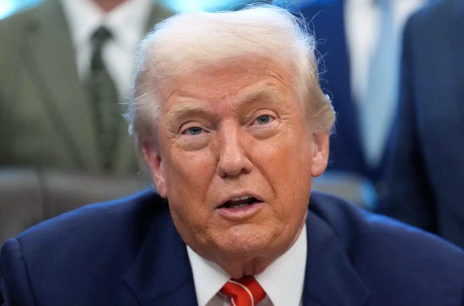 President Donald Trump speaks to reporters after signing a spending bill that ends a partial shutdown of the federal government in the Oval Office of the White House, Tuesday, Feb. 3, 2026, in Washington. (AP Photo/Alex Brandon)