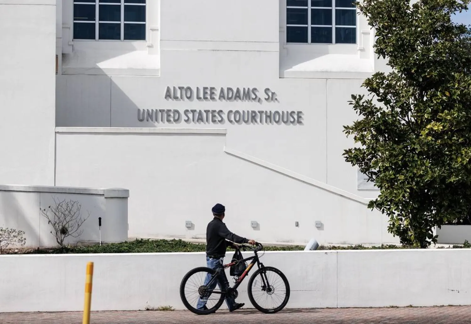 A person walks past the Alto Lee Adams Sr. US Courthouse as the sentencing hearing of Ryan Routh takes place in Fort Pierce, Florida, USA, 04 February 2026. (EPA)