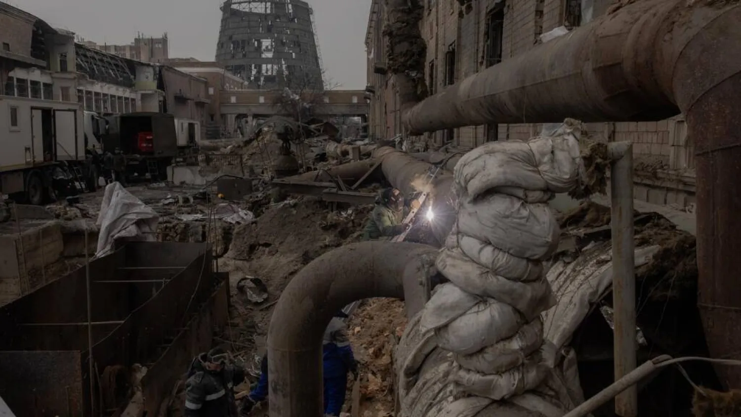 Employees repair sections of the Darnytska combined heat and power plant damaged by Russian air strikes in Kyiv, on February 4, 2026, during the Russian invasion of Ukraine. Roman PILIPEY / AFP

